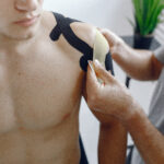 Doctor glues a tepee to an athlete at the hospital